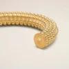 Armband i guld och mässing med pärlor
