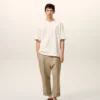 Beige bomullsbyxor i karotmodell med oversized-passform Beige bomullsbyxor i karotmodell med oversized-passform