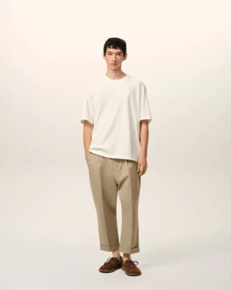 Beige bomullsbyxor i karotmodell med oversized-passform