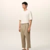 Beige bomullsbyxor i karotmodell med oversized-passform Beige bomullsbyxor i karotmodell med oversized-passform
