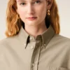 Beige bomullsskjorta i kort modell med präglad Ami de Coeur Beige bomullsskjorta i kort modell med präglad Ami de Coeur