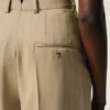 Beige byxor i nykammad ull med hög midja och vida ben Beige byxor i nykammad ull med hög midja och vida ben