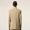 Beige jacka i ny ull med enkelknäppning och boxig passform Beige jacka i ny ull med enkelknäppning och boxig passform