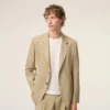 Beige jacka i ny ull med enkelknäppning och rak passform Beige jacka i ny ull med enkelknäppning och rak passform