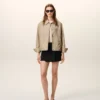 Beige nylonjacka med Ami de Coeur-knappar