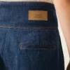 Blå bomullsjeans med omslutet bälte och ballongpassform Blå bomullsjeans med omslutet bälte och ballongpassform