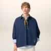 Blå bomullspolo med långa ärmar från Ami de Coeur Polo Blå bomullspolo med långa ärmar från Ami de Coeur Polo
