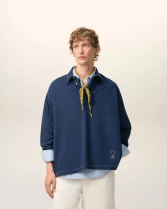Blå bomullspolo med långa ärmar från Ami de Coeur Polo