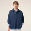 Blå bomullspolo med långa ärmar från Ami de Coeur Polo Blå bomullspolo med långa ärmar från Ami de Coeur Polo