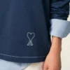 Blå bomullspolo med långa ärmar från Ami de Coeur Polo Blå bomullspolo med långa ärmar från Ami de Coeur Polo