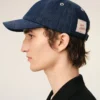 Blå denimkeps med Ami Paris-märke på sidan Blå denimkeps med Ami Paris-märke på sidan