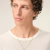 Halsband med hamrat ”0” i guldmässing Halsband med hamrat ”0” i guldmässing