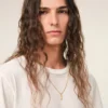 Halsband med hamrat ”7” i guldmässing Halsband med hamrat ”7” i guldmässing