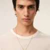 Halsband med hamrat ”9”-hänge i guldmässing Halsband med hamrat ”9”-hänge i guldmässing