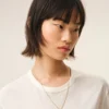 Halsband med hamrat ”9”-hänge i guldmässing Halsband med hamrat ”9”-hänge i guldmässing