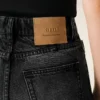 Svarta bomullsjeans med utsvängd passform Svarta bomullsjeans med utsvängd passform