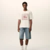 Vit bomullst-shirt med Ami Paris Heritage-tryck