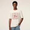 Vit bomullst-shirt med Ami Paris Heritage-tryck
