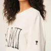 Vit bomullst-shirt med Ami Paris-tryck Vit bomullst-shirt med Ami Paris-tryck