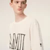 Vit bomullst-shirt med Ami Paris-tryck Vit bomullst-shirt med Ami Paris-tryck