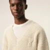 Vit ribbad ulltröja med V-ringning från Ami de Coeur Sweater Vit ribbad ulltröja med V-ringning från Ami de Coeur Sweater